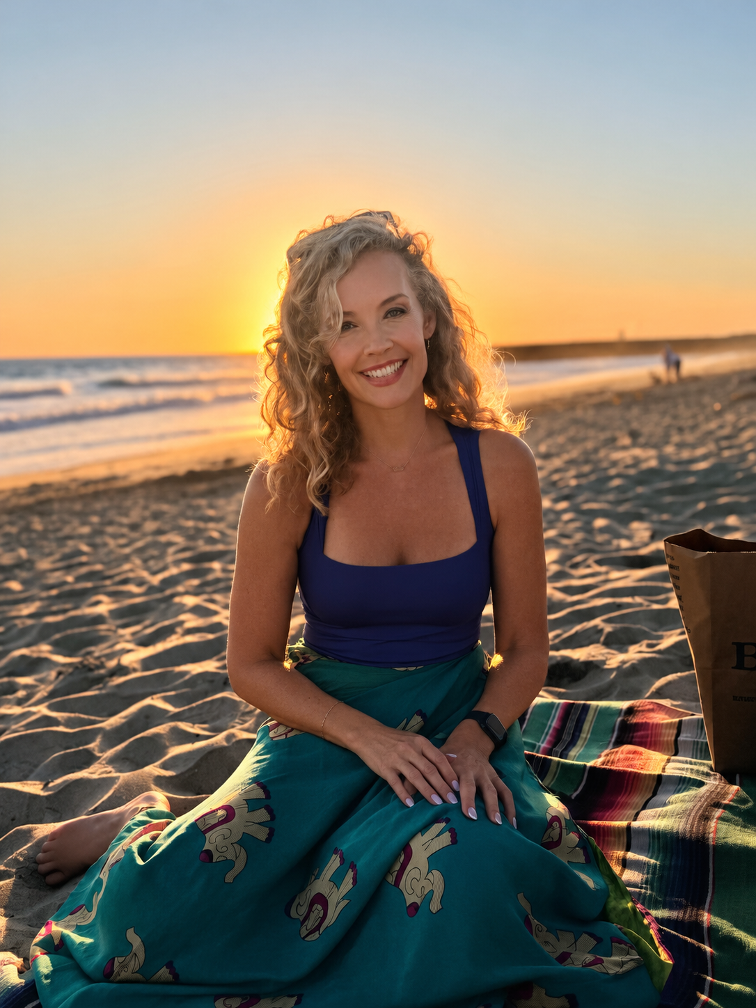 Savannah Miller, MSW, LICSW, LCSW sitting on a California beach at sunset